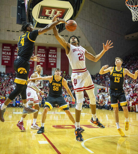 Indiana uses 3-point flurry to beat No. 21 Iowa, end skid